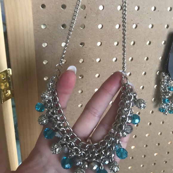 Silver necklace w/aqua, silver, & crystal beads.